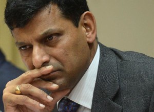 Reserve Bank of India (RBI) governor, Raghuram Rajan pauses during a news conference at the RBI headquarters in Mumbai on September 20, 2013. India's new central bank governor marked his first policy meeting on September 20 with a bold decision to hike interest rates, wrong-footing analysts and leading to sharp falls on the stock market.  AFP PHOTO/ PUNIT PARANJPE